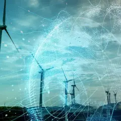 Wind turbines on a hill with a digital globe overlay and data points.