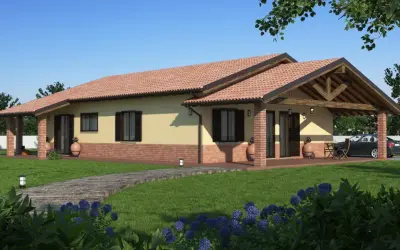 Una casa prefabbricata moderna con tetto in tegole rosse, portico in mattoni e un vialetto in legno su un prato verde.