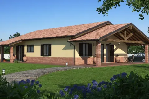 Una casa prefabbricata moderna con tetto in tegole rosse, portico in mattoni e un vialetto in legno su un prato verde.