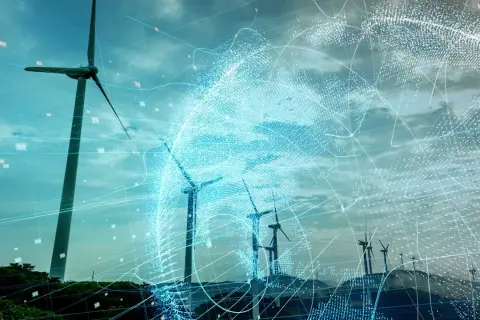 Wind turbines on a hill with a digital globe overlay and data points.