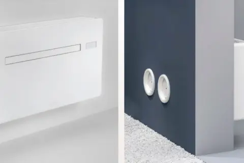 Condizionatori senza unità esterna: come funzionano. Immagine mostra un'unità interna bianca e due bocchette a muro.