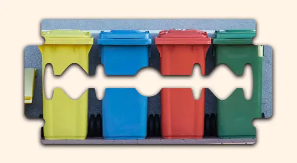 Contenitori colorati per la raccolta differenziata, un promemoria visivo su dove si buttano i rasoi usa e getta.