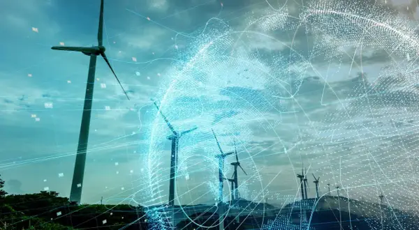 Wind turbines on a hill with a digital globe overlay and data points.