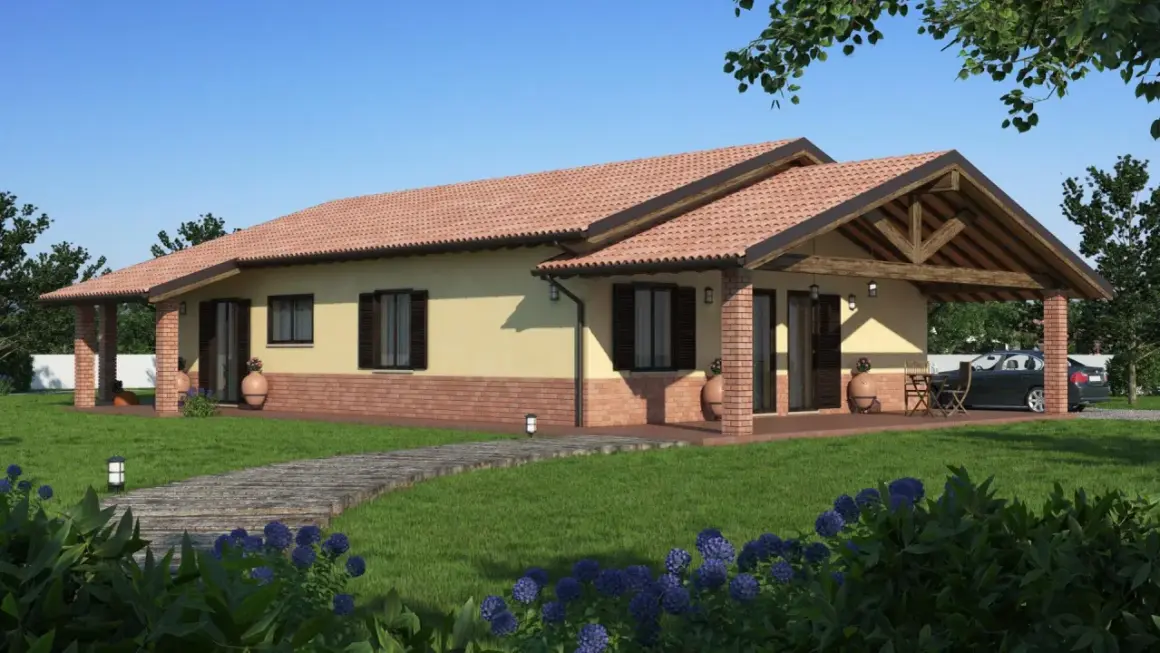 Una casa prefabbricata moderna con tetto in tegole rosse, portico in mattoni e un vialetto in legno su un prato verde.