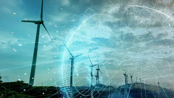 Wind turbines on a hill with a digital globe overlay and data points.